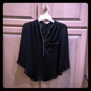 Mid length black top with white detail